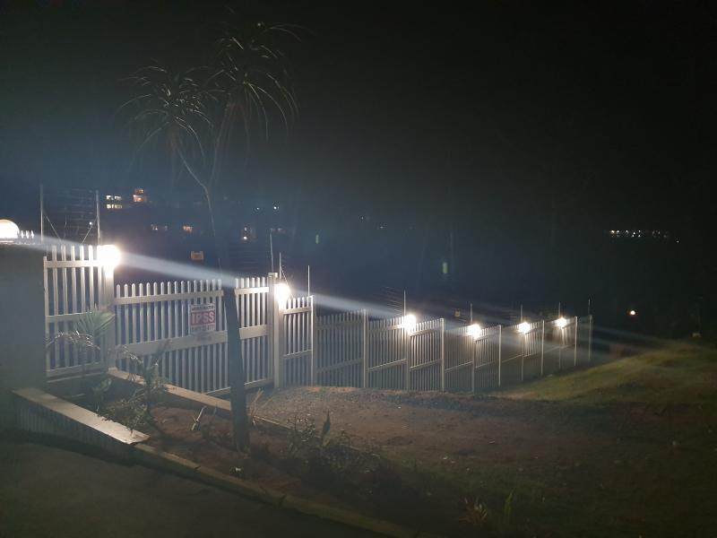 pvc palisade fence & driveway sliding gate night