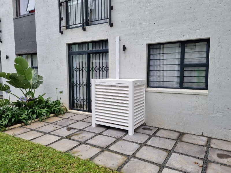 close up of the pvc ac cover showing louvered slats for airflow and durability
